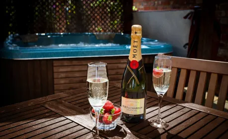 At Mill Farm Leisure's Sycamore Cottage, indulge in moments of luxury and serenity by the hot tub.