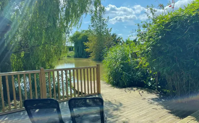 Secluded Fishing on the decking at Willow Lodge, Mill Farm Leisure